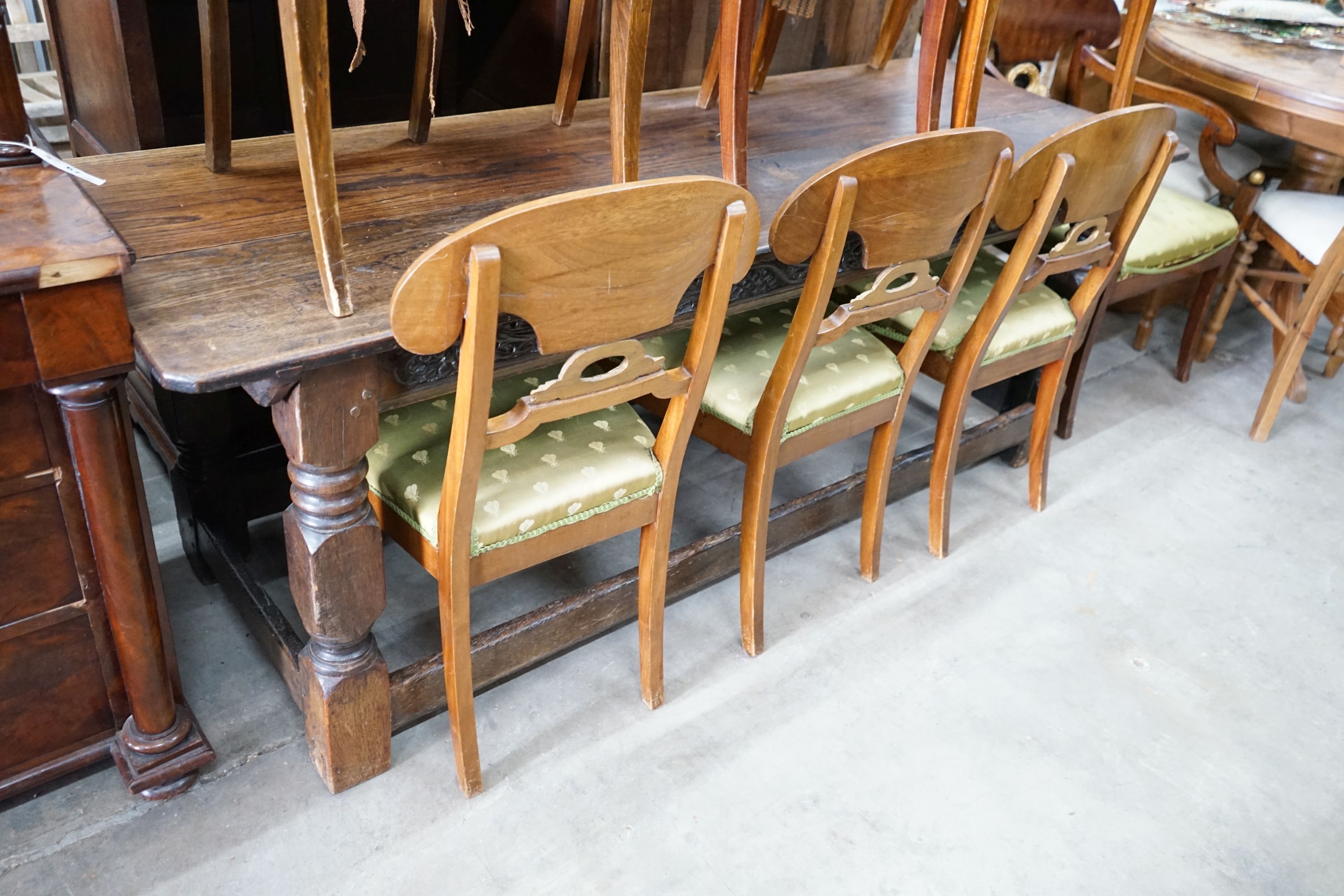 A set of eight Swedish Biedermeier birch with mahogany veneer, wreath design dining room chairs, including two carvers, mid 19th century